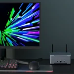 Real scene photo of HYSTOU compact AMD mini PC on office desktop, match gaming monitor, mechanical keyboard and mouse for home & business use