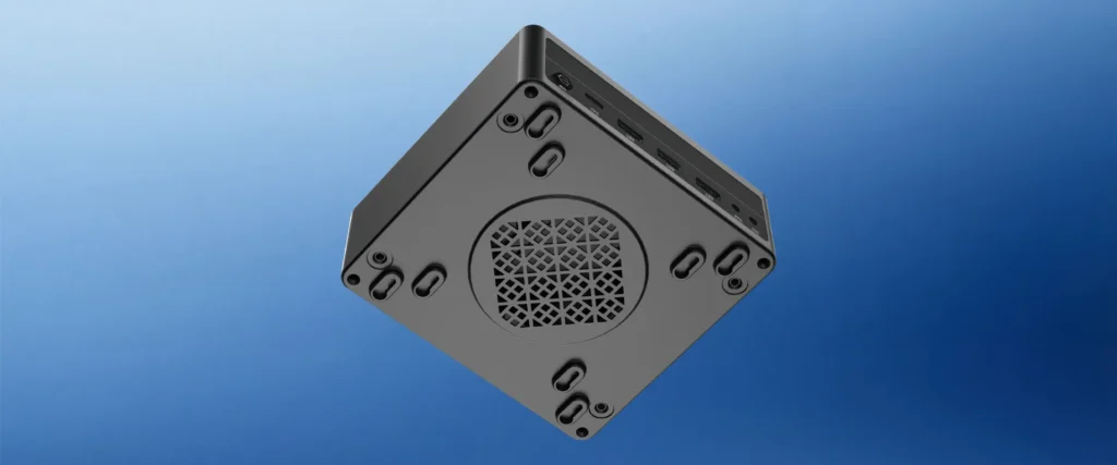 Bottom view of the HYSTOU M6 Mini PC revealing the intake cooling vents, rubber feet, and mounting screw holes for versatile industrial setups.