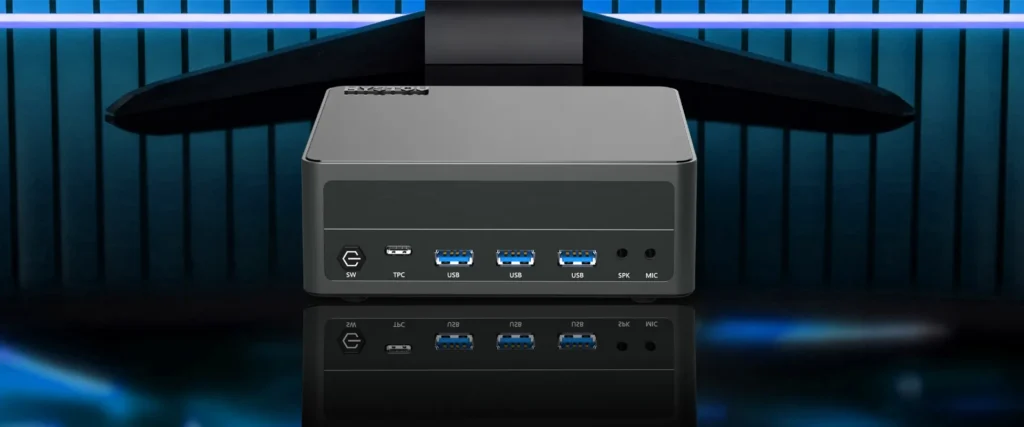 Front profile of the HYSTOU M6 Ryzen 7 7840HS Mini PC on a dark reflective surface, highlighting its compact chassis and accessible front panel ports.